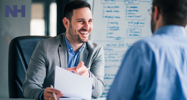 A recruiter going over a contract with an applicant